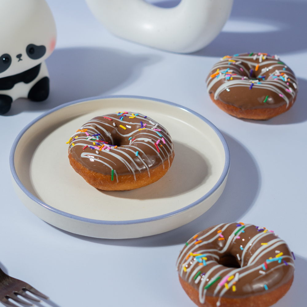 Milk Chocolate Donut Milk chocolate glazed donut from Le Fou Delight bakery, Vadodara