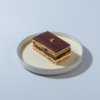 Opera Pastry Le Fou Delights French opera pastry slice with layers of almond sponge, chocolate ganache, and coffee buttercream