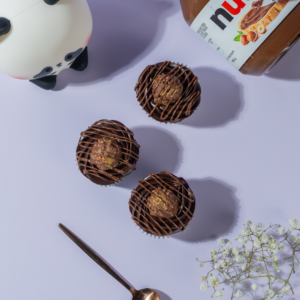 Ferrero Rocher Cupcake in Vadodara topped with chocolate frosting, Nutella filling, and Ferrero Rocher by Le Fou Delight