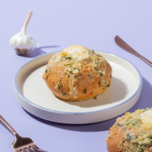 Golden toasted Korean garlic bun stuffed with creamy garlic cream cheese fillingGolden toasted Korean garlic bun stuffed with creamy garlic cream cheese filling