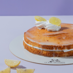 Lemon Drizzle Cake in Vadodara with soft lemon sponge, signature lemon drizzle, and Chantilly cream by Le Fou Delight