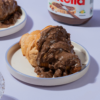 Rocher Glazed Croissant in Vadodara filled with Nutella and topped with Ferrero Rocher-inspired glaze by Le Fou Delight