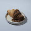 Rocher Glazed Croissant in Vadodara filled with Nutella and topped with Ferrero Rocher-inspired glaze by Le Fou Delight