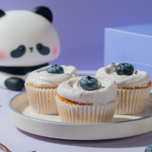 Freshly baked eggless blueberry cupcakes with compote center ready for delivery in Vadodara
