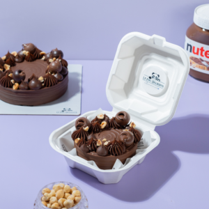 Nutella Hazelnut Cake slice with truffle ganache and roasted hazelnuts, Le Fou Delight Vadodara