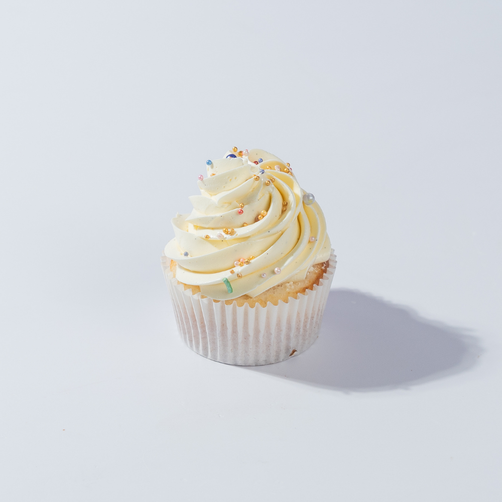 Vanilla Bean Buttercream Cupcake Classic eggless vanilla cupcake topped with rich, real vanilla bean buttercream swirl