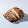 Freshly prepared savory olive and sun-dried tomato sourdough bread ready for delivery in Vadodara