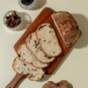 Freshly prepared savory olive and sun-dried tomato sourdough bread ready for delivery in Vadodara