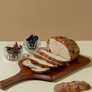 Freshly prepared savory olive and sun-dried tomato sourdough bread ready for delivery in Vadodara