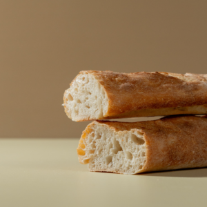 Fresh artisan French baguette with a crisp golden crust from Le Fou Delight in Vadodara
