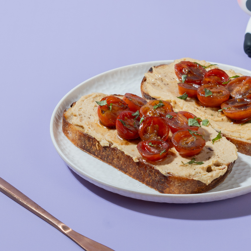 Fresh Balsamic & Roasted Tomato Hummus Toast on artisan sourdough at Le Fou Delight Vadodara