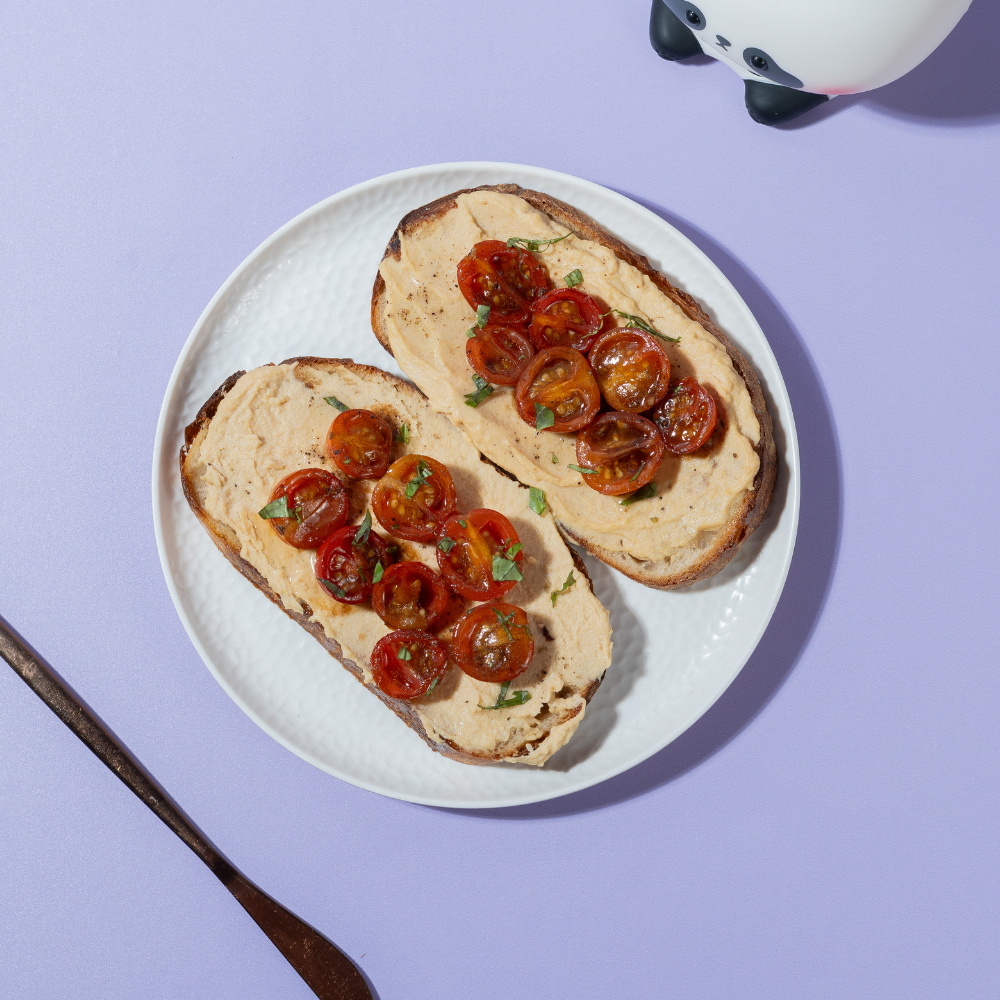 Fresh Balsamic & Roasted Tomato Hummus Toast on artisan sourdough at Le Fou Delight Vadodara