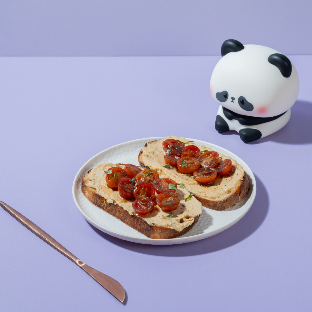 Fresh Balsamic & Roasted Tomato Hummus Toast on artisan sourdough at Le Fou Delight Vadodara