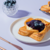 Golden baked blueberry custard Danish pastry topped with fresh blueberry filling