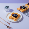 Golden baked blueberry custard Danish pastry topped with fresh blueberry filling