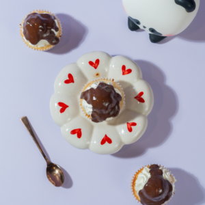 Boston Cream Cupcake in Vadodara with vanilla sponge, custard filling, Chantilly cream, and chocolate topping by Le Fou Delight