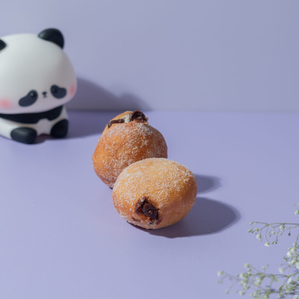 Chocolate Caramel Bomboloni from Le Fou Delight, Vadodara, filled with gooey caramel
