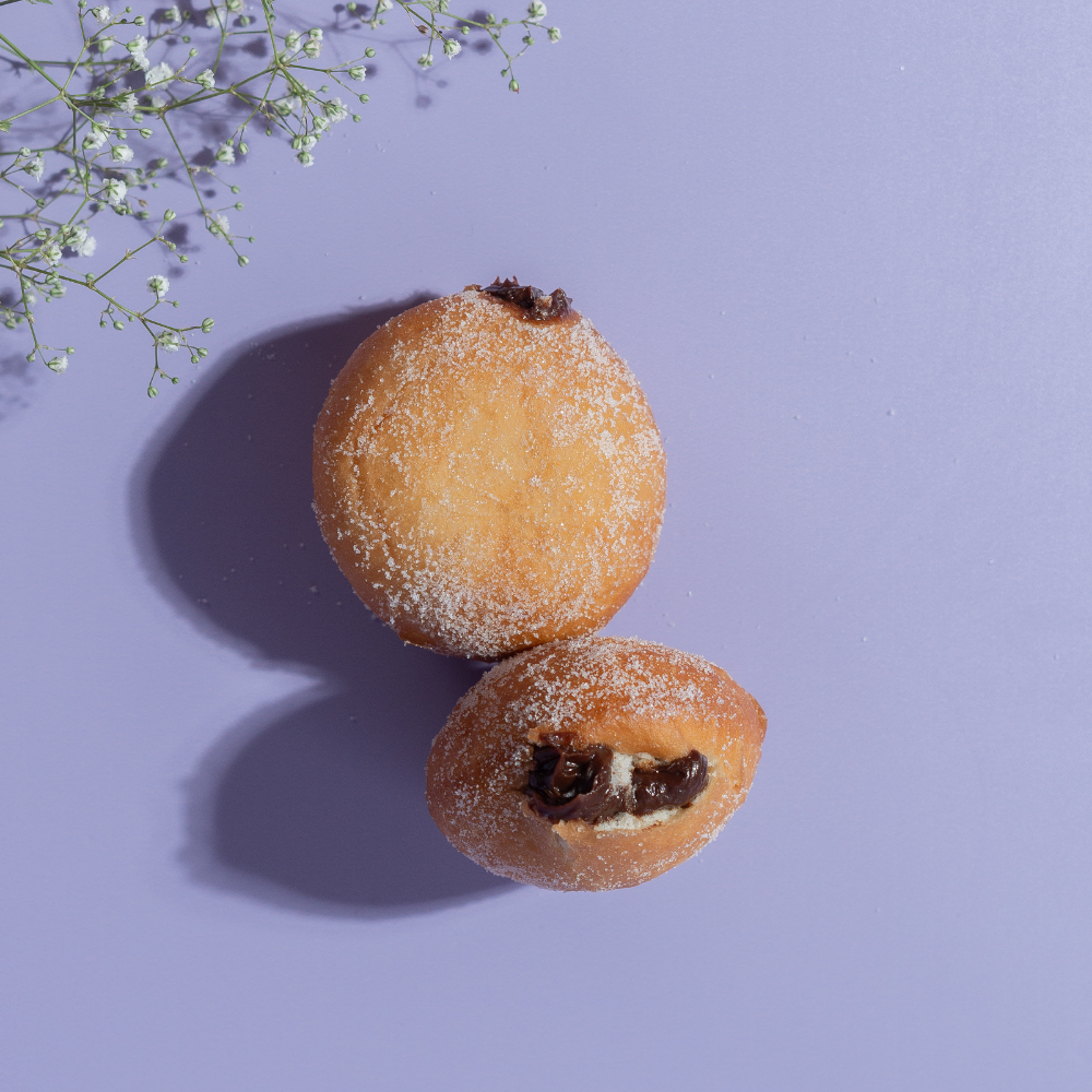 Chocolate Caramel Bomboloni from Le Fou Delight, Vadodara, filled with gooey caramel