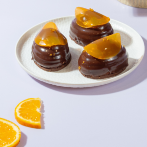 Freshly prepared eggless chocolate orange entremet ready for delivery in Vadodara