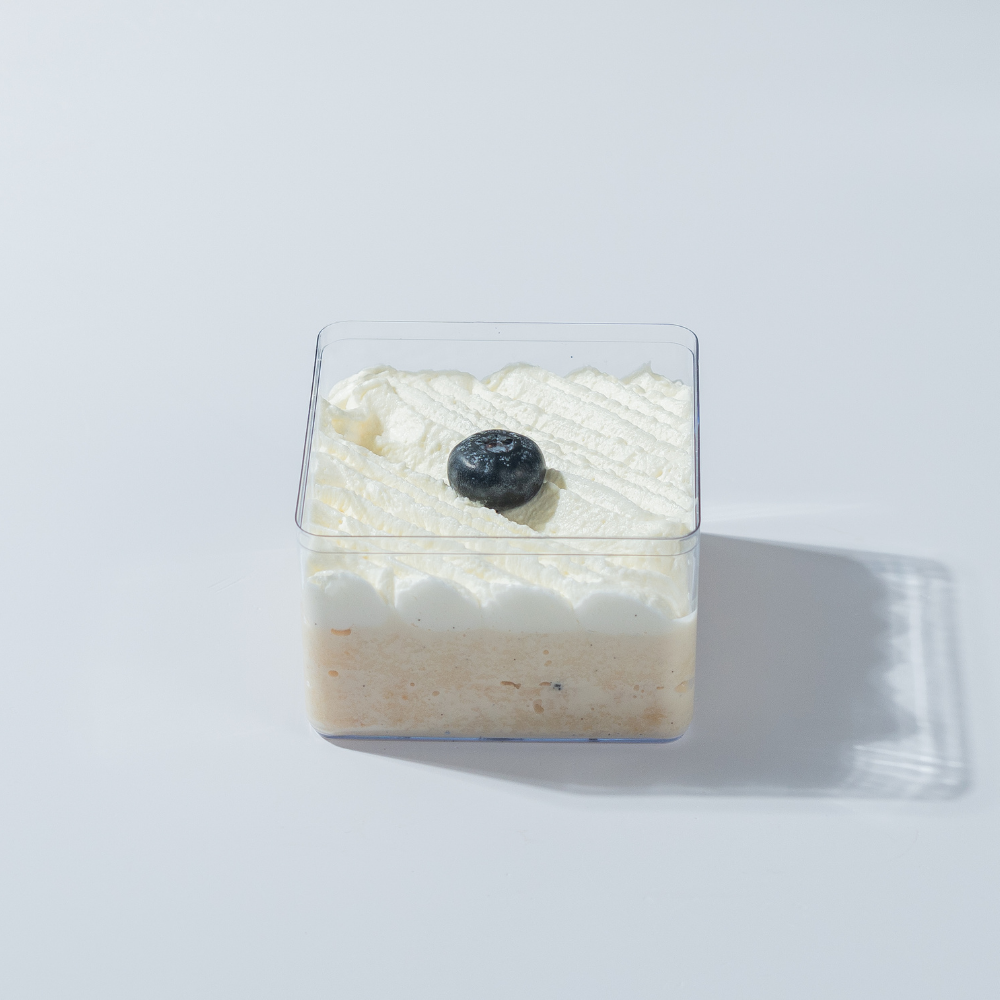 Freshly made eggless vanilla tres leches cake tub in Vadodara by Le Fou Delight