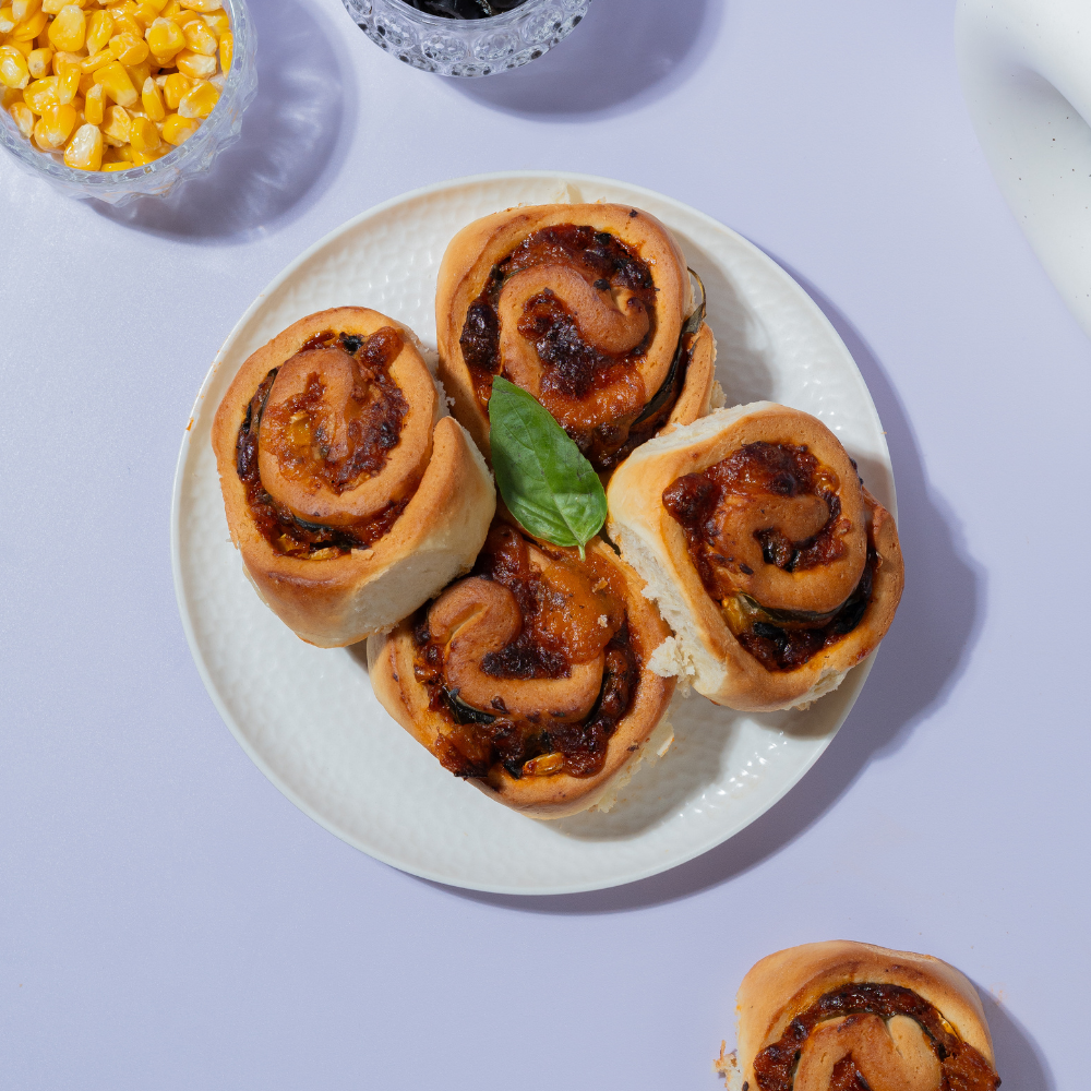 Fresh Corn & Olives Roll with buttery puff pastry baked by Le Fou Delight in Vadodara