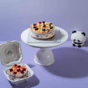 Eggless fresh fruit gateaux cake topped with vibrant seasonal fruits by Le Fou Delight Vadodara
