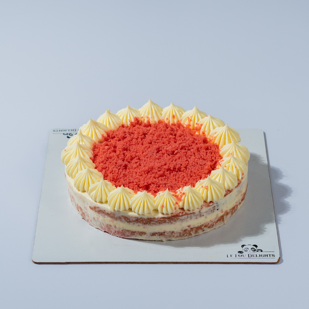 Elegant gluten-free red velvet cake slice layered with rich cream cheese frosting