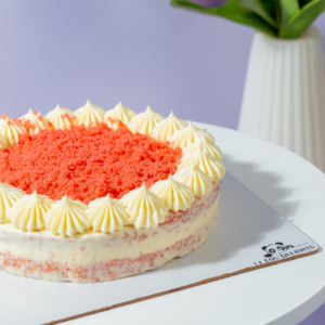 Elegant gluten-free red velvet cake slice layered with rich cream cheese frosting