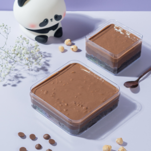 Hazelnut Matilda Cake Tub in Vadodara with layers of chocolate sponge, hazelnut cream, chocolate ganache, and Rocher glaze by Le Fou Delight