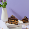Le Fou’s Crazy Cake Slice with chocolate layers and crunchy nuts