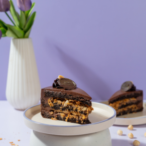 Le Fou’s Crazy Cake Slice with chocolate layers and crunchy nuts