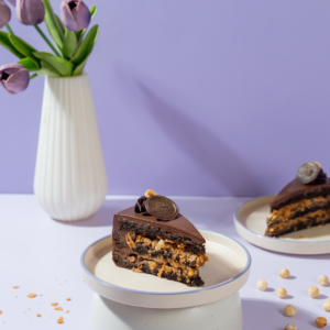 Le Fou’s Crazy Cake Slice with chocolate layers and crunchy nuts
