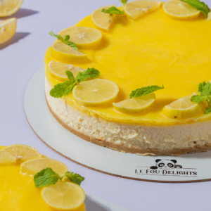 Fresh Lemon Cheesecake in Vadodara by Le Fou Delight with creamy New York-style filling, buttery biscuit crust, and fresh lemon topping.