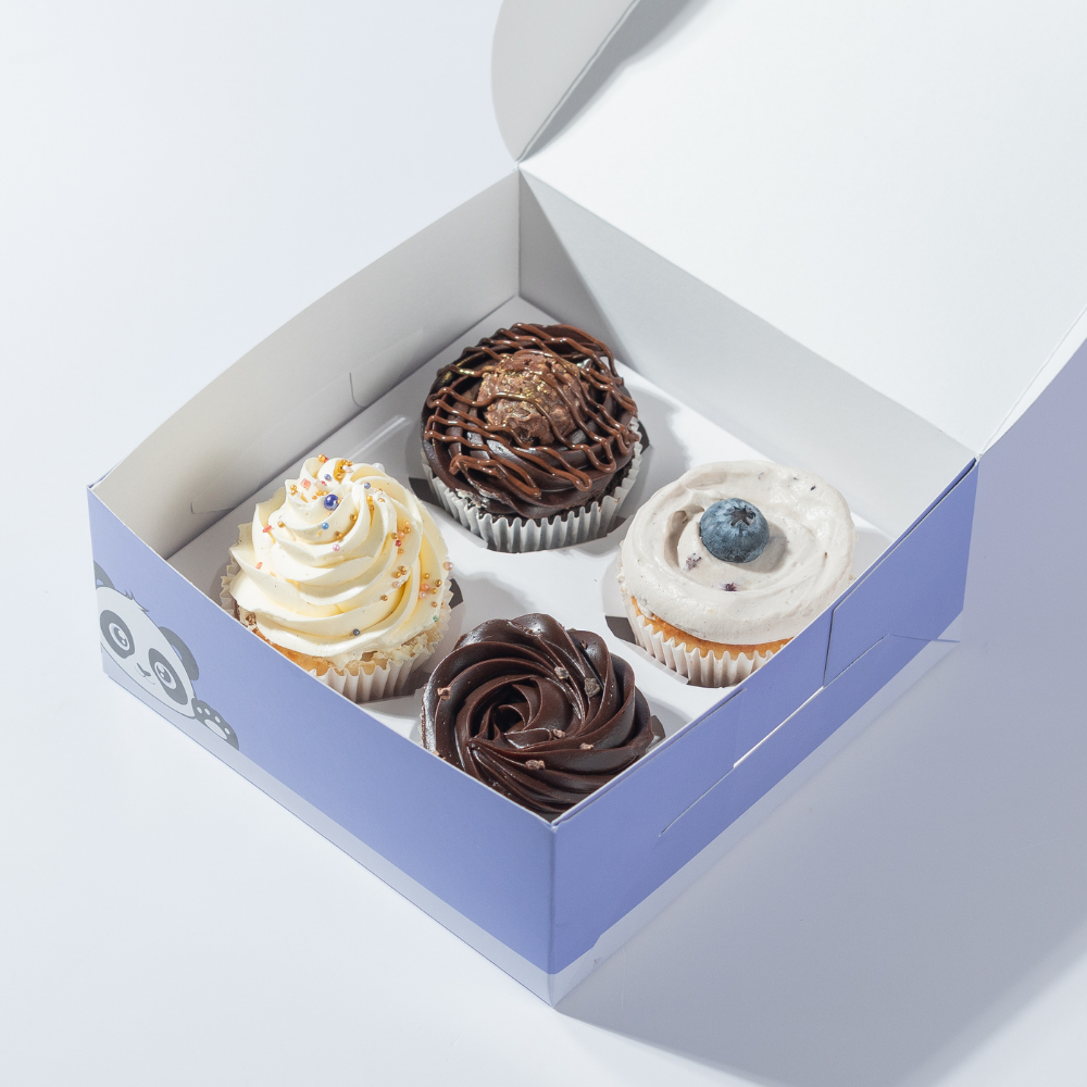 Pack of 4 Cupcake Pack of 4 cupcakes in Vadodara by Le Fou Delights with chocolate, vanilla, and blueberry toppings, freshly baked and decorated with creamy frosting.