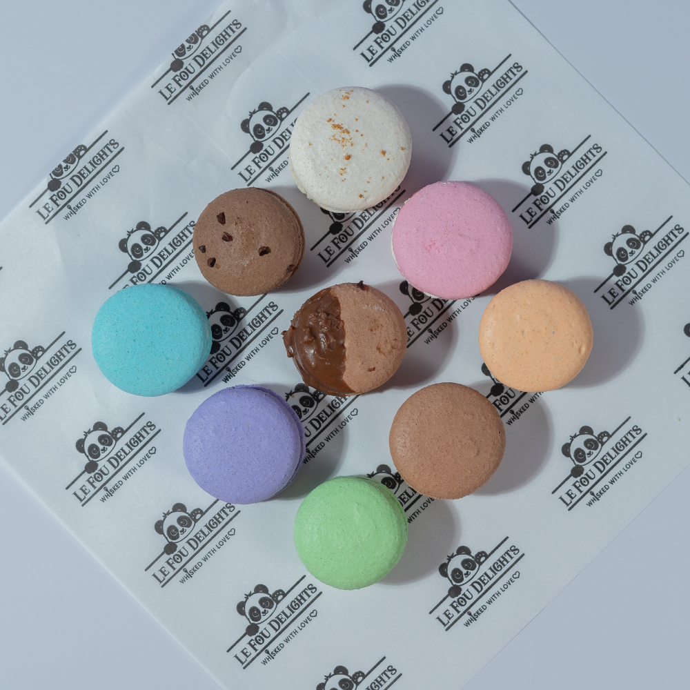 A Pack of 9 Macaron from Le Fou Delight. Enjoy crisp shells, smooth fillings and vibrant colours, perfect for gifting and celebrations.