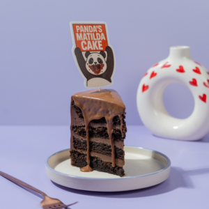 Le Fou Delights Matilda pastry slice with moist chocolate cake layers and thick chocolate fudge frosting