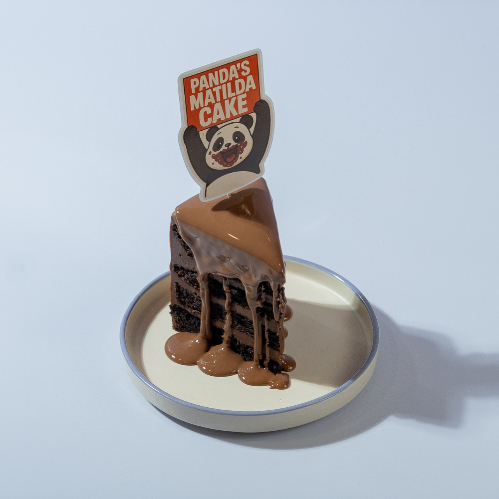 Le Fou Delights Matilda pastry slice with moist chocolate cake layers and thick chocolate fudge frosting