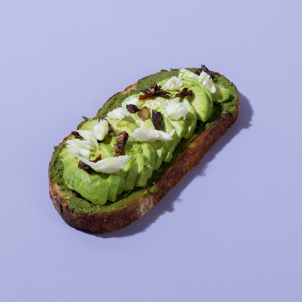 Freshly prepared healthy pesto avocado sourdough toast ready for delivery in Vadodara