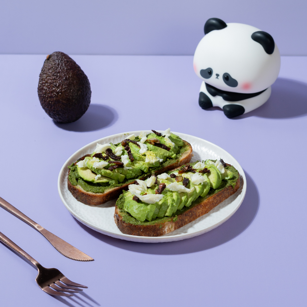 Freshly prepared healthy pesto avocado sourdough toast ready for delivery in Vadodara