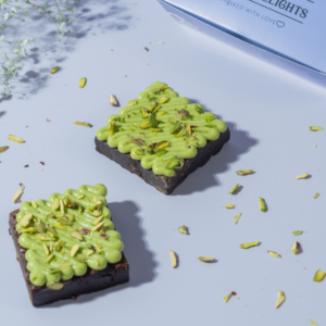 Handcrafted Pistachio Brownie in Vadodara by Le Fou Delight, rich fudgy chocolate topped with roasted pistachios