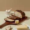 Freshly prepared savory garlic parmesan sourdough bread ready for bakery delivery in Vadodara