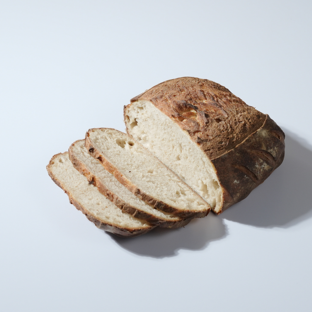 Freshly prepared savory garlic parmesan sourdough bread ready for bakery delivery in Vadodara