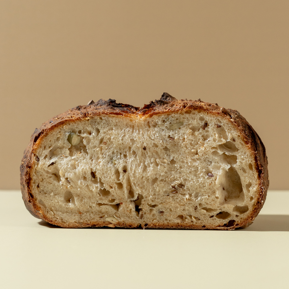 The Country Sourdough Sliced artisan country sourdough bread showing a soft airy crumb structure