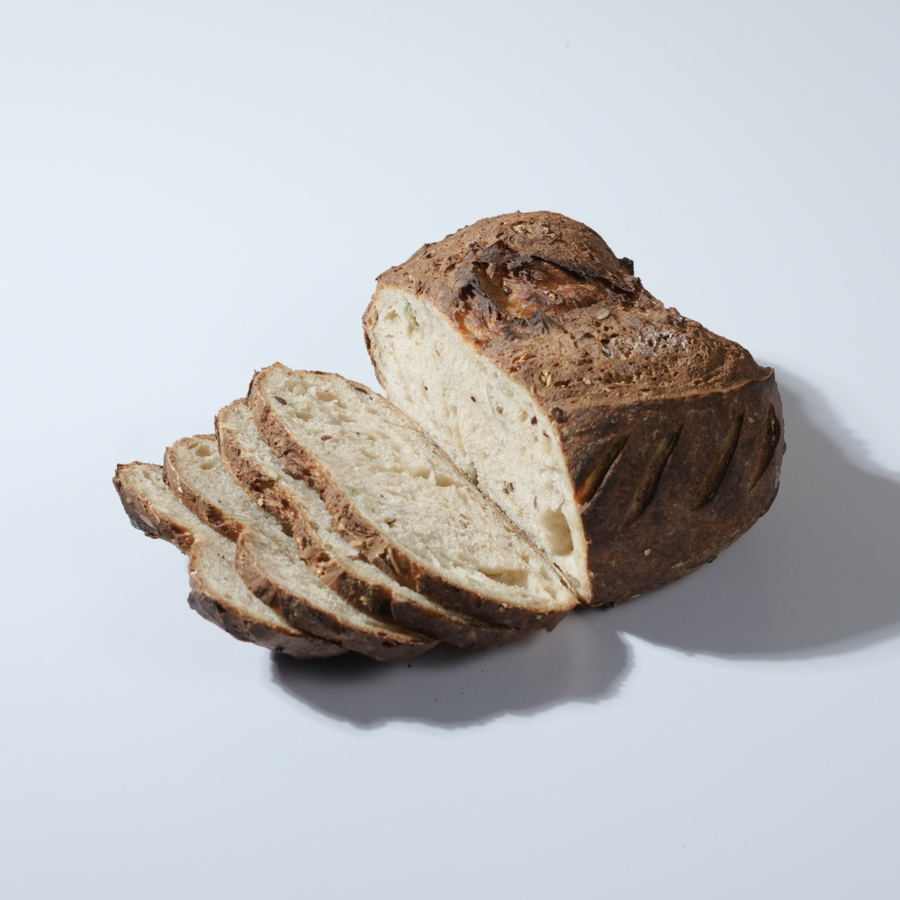 The Country Sourdough Sliced artisan country sourdough bread showing a soft airy crumb structure