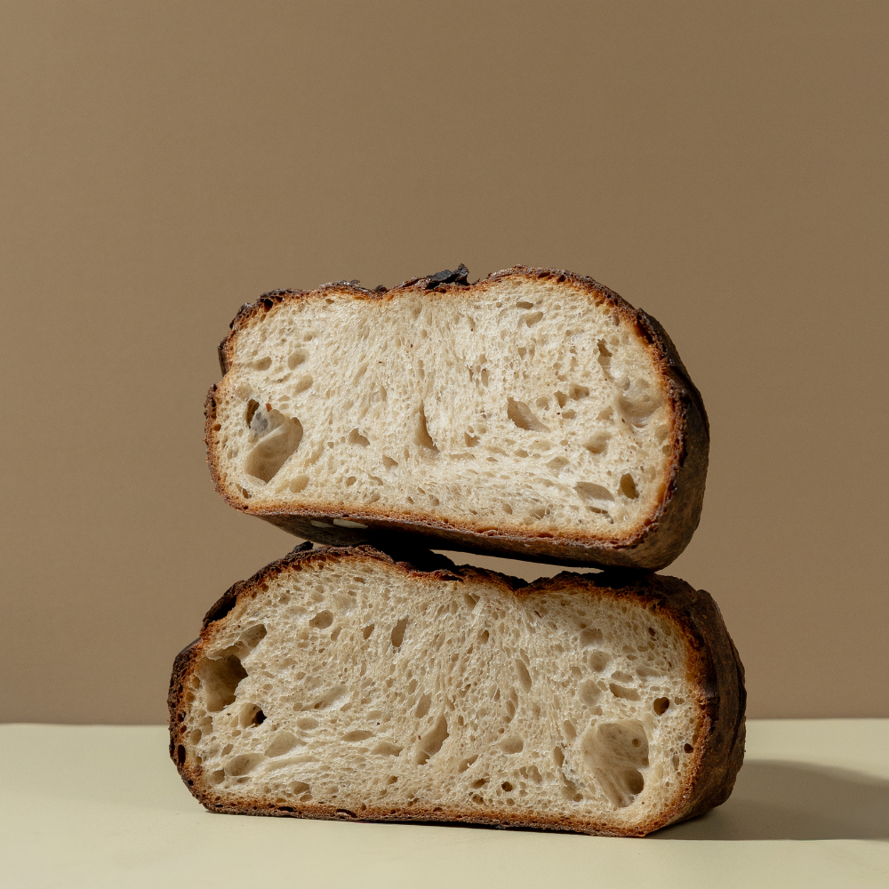 The Country Sourdough Sliced artisan country sourdough bread showing a soft airy crumb structure