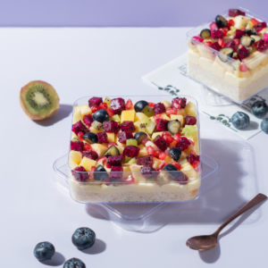 Layered eggless fruit trifle dessert tub with fresh seasonal fruits by Le Fou Delight Vadodara
