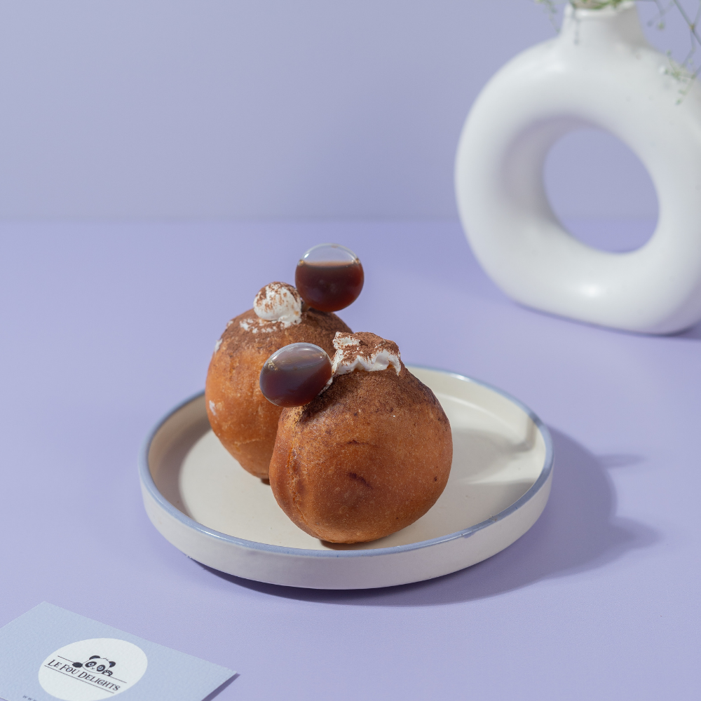 Tiramisu Bomboloni from Le Fou Delight, Vadodara, dusted with cocoa