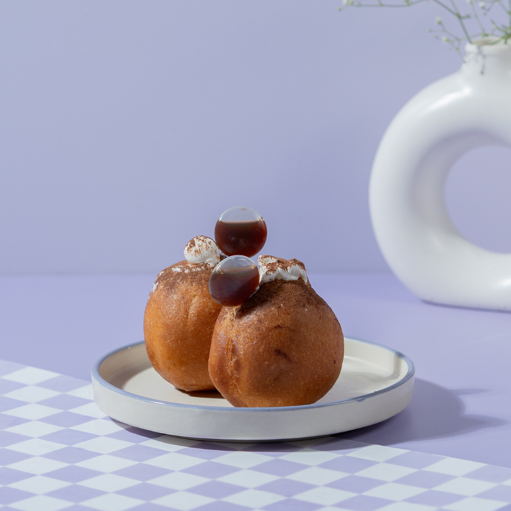Tiramisu Bomboloni from Le Fou Delight, Vadodara, dusted with cocoa