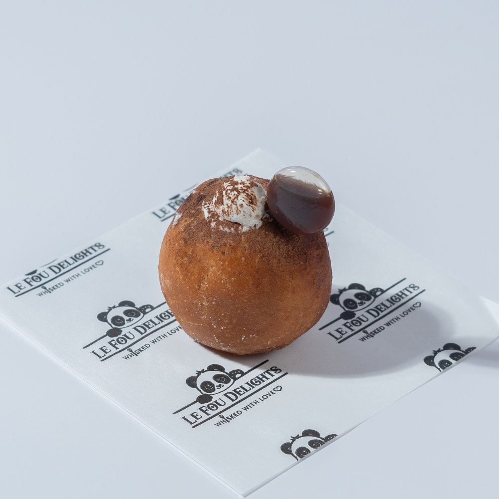 Tiramisu Bomboloni from Le Fou Delight, Vadodara, dusted with cocoa
