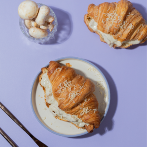 Flaky French savory truffle mushroom croissant filled with creamy mushrooms by Le Fou Delight Vadodara